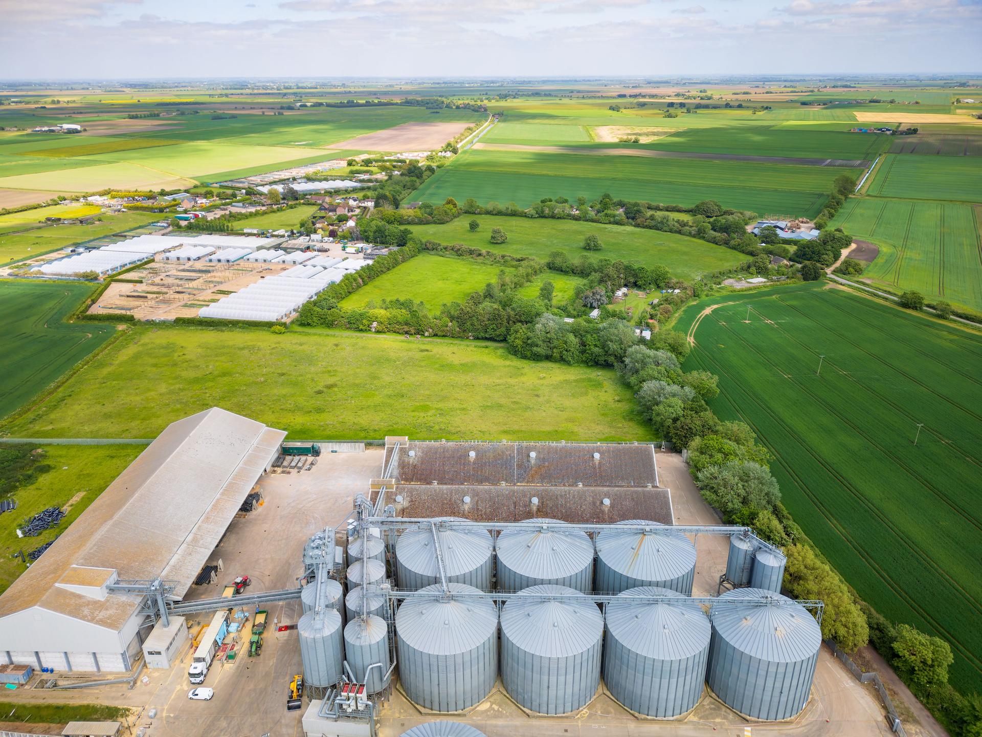 Aerial view of a British grain silo and storage facility showing the multiple storage and drying tanks.